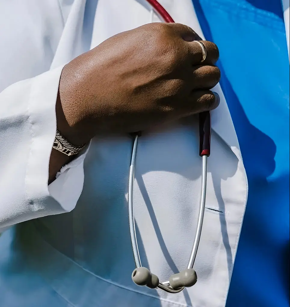 A person holding a stethoscope in their hand.